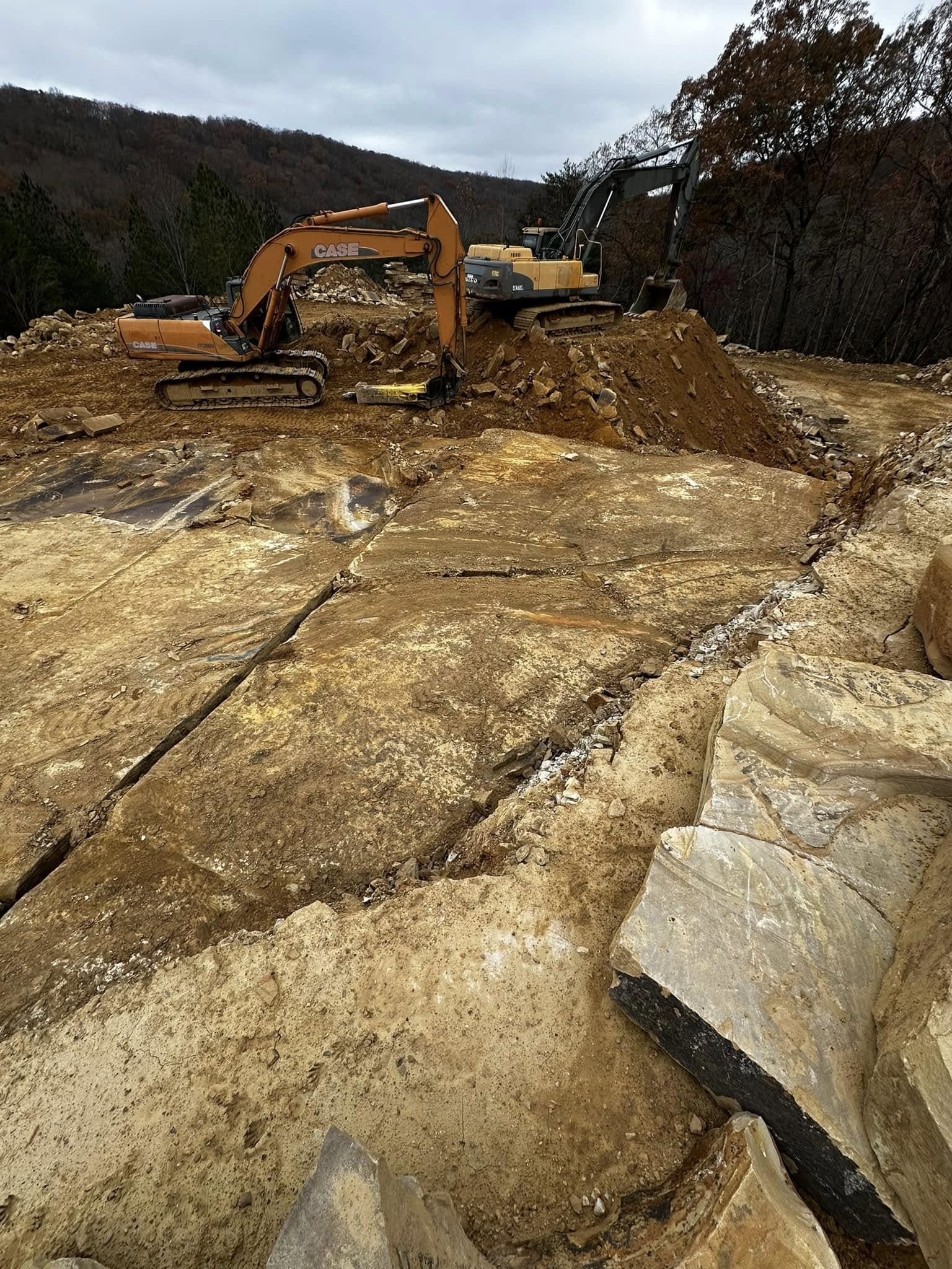 Excavators extracting Tennessee sandstone at the Deer Creek Stone quarry